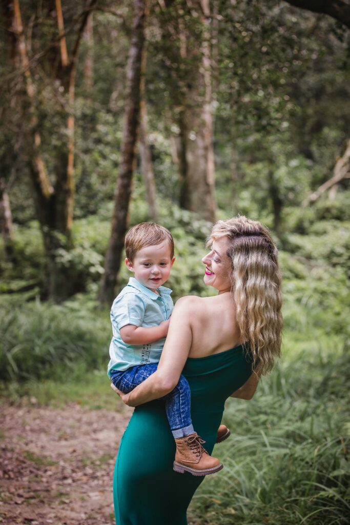 Mother carrying her toddler son in a beautiful forest, Outdoor family photo session. JDL Photography. Johannesburg and Pretoria photographer